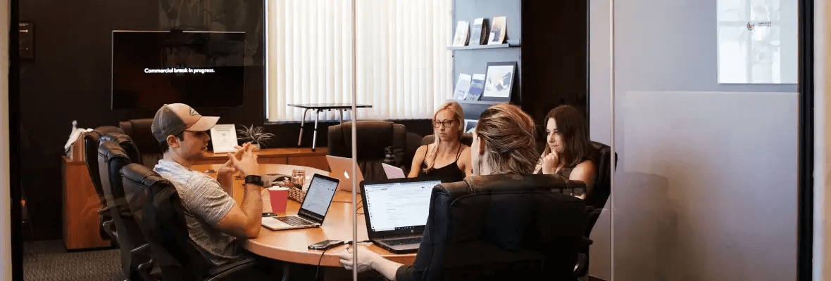 Professional insurance consultation meeting with AmeriTrust team and clients